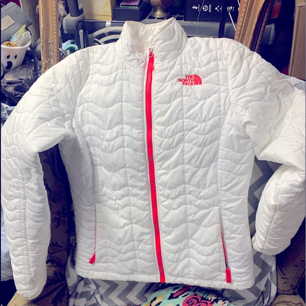 The North Face White jacket with pink accents.